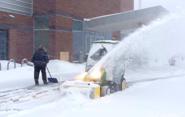 Snow is cleared outside of the Ramsey County Library in Roseville, Minn. on Thursday, Jan. 30, 2014. Jeffrey Thompson / MPR News