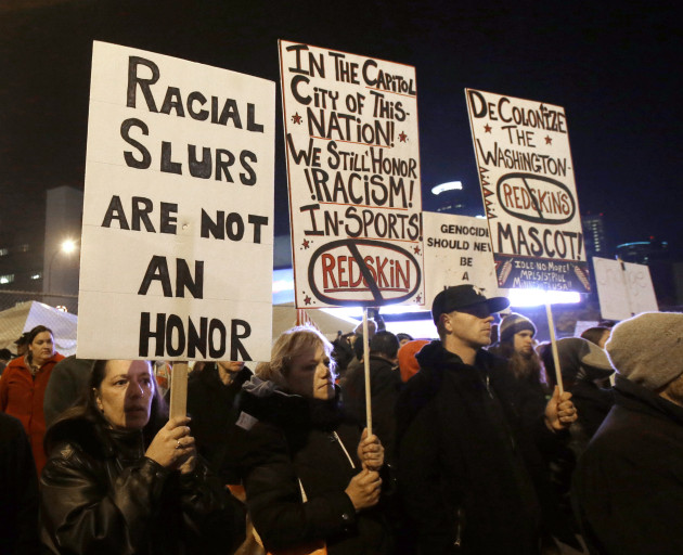 American Indians and their supporters gather outside the Metrodome to protest the Washington Redskins name, prior to a game between the team and the Minnesota Vikings in 2013. (AP Photo/Jim Mone)